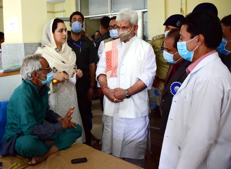 LG Manoj Sinha interacting with a patient at SDH Sopore on Friday.
