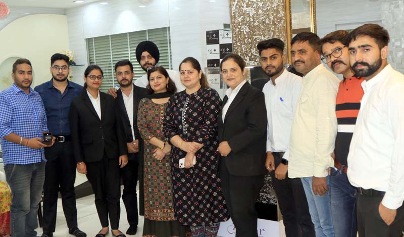 Executives of 'Zevar' along with others posing for group photograph after announcing winners of Lucky Draw. Executives of 'Zevar' along with others posing for group photograph after announcing winners of Lucky Draw.