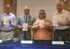 Former DGP of J&K Police Dr Ashok Bhan and other dignitaries releasing a book at Amar Singh Club, Jammu.