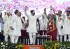 Congress leader Rahul Gandhi dancing with party workers during a public meeting, in Dahod on Tuesday. (UNI)