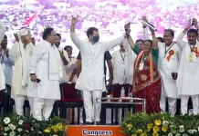 Congress leader Rahul Gandhi dancing with party workers during a public meeting, in Dahod on Tuesday. (UNI)