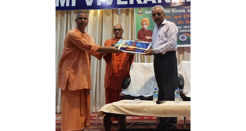 The main guest presenting a souvenir to a participant during a reception hosted by Swami Rama Krishna Mission in Jammu on Monday.