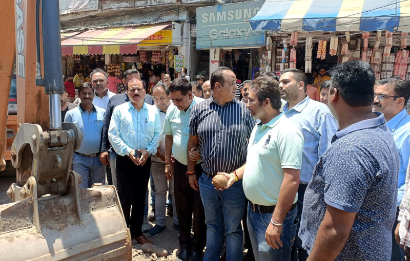JMC Mayor Chander Mohan Gupta along with others taking stock of development activities at Warehouse Market in Jammu on Wednesday.