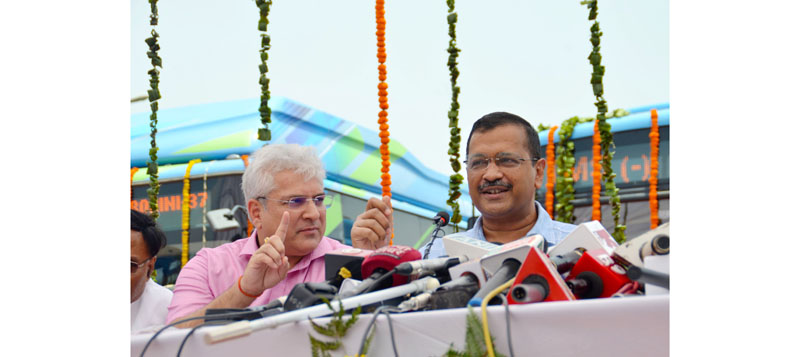 Delhi Chief Minister Arvind Kejriwal and Transport Minister Kailash Gahlot addressing at the flag-off of 150 new electric buses, in New Delhi on Tuesday. (UNI)