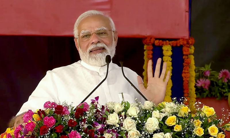 Prime Minister Narendra Modi addressing a public meeting at Atkot in Rajkot district on Saturday. (UNI) Prime Minister Narendra Modi addressing a public meeting at Atkot in Rajkot district on Saturday. (UNI)