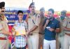 SSP Randeep Kumar awarding a student during a painting competition at Rajouri on Thursday.