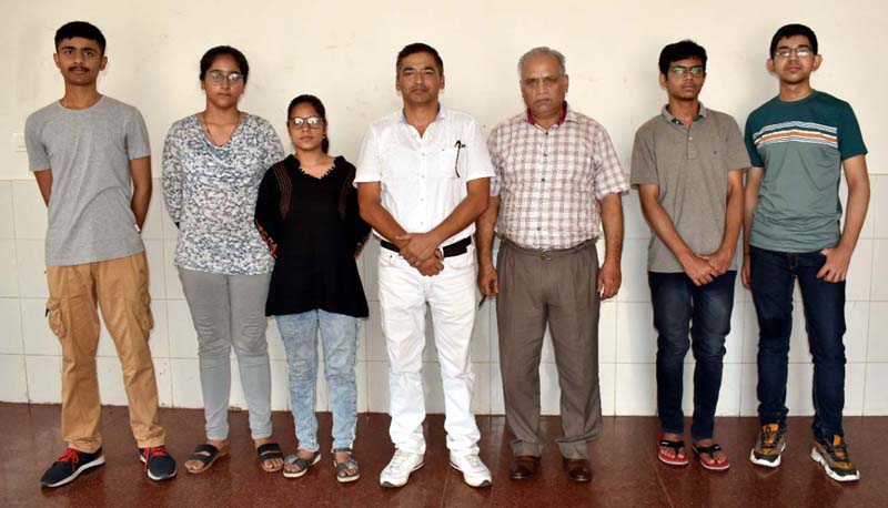 Selected Chess players posing for a group photograph with Divisonal Sports Officer Ashok Singh and others at Jammu on Monday.