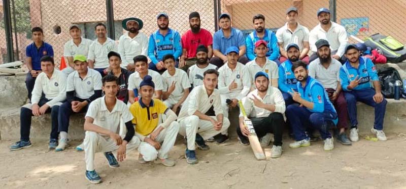 Players posing for group photograph after a cricket match. Players posing for group photograph after a cricket match.