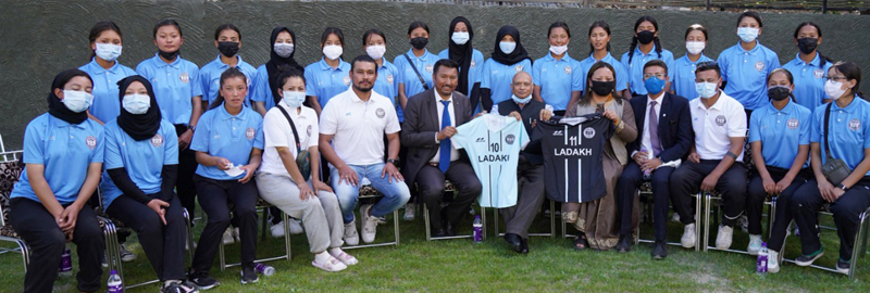 Lt.Governor R K Mathur and women football team players posing for group photograph. Lt.Governor R K Mathur and women football team players posing for group photograph.