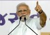 Prime Minister Narendra Modi addressing at the inauguration and foundation stone laying ceremony of multiple development projects during the Gujarat Gaurav Abhiyana, in Navsari on Friday. (UNI)