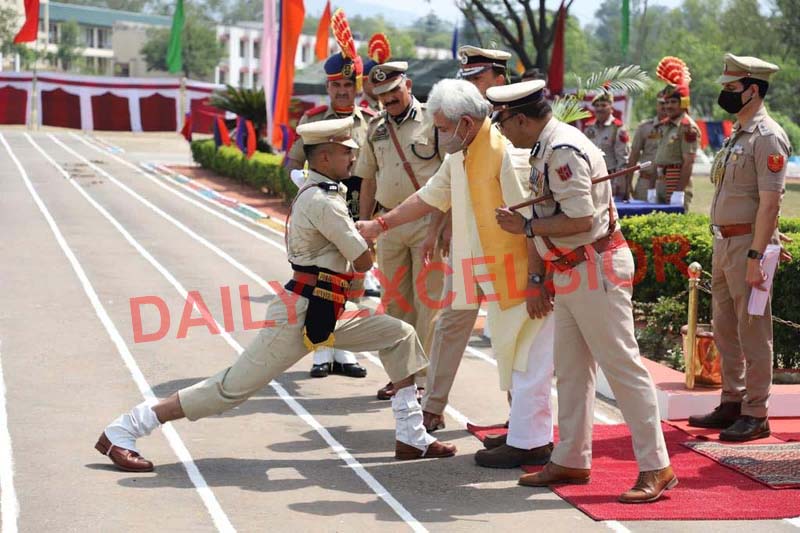 Lieutenant Governor Manoj Sinha installs badge on a recruit at SKPA Udhampur on Thursday. -Excelsior/K Kumar Lieutenant Governor Manoj Sinha installs badge on a recruit at SKPA Udhampur on Thursday. -Excelsior/K Kumar