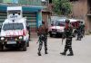 Security personnel outside the EDB branch at Arreh Mohanpora in Kulgam on Thursday. - Excelsior/Sajad Dar