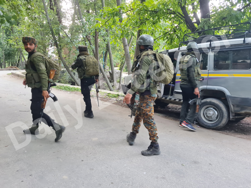Security personnel at the site of encounter at Kulgam on Wednesday. - Excelsior/Sajad Dar Security personnel at the site of encounter at Kulgam on Wednesday. - Excelsior/Sajad Dar