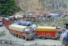 Trucks stranded on National Highway near Ramban after landslides in Panthyal area on Tuesday. -Excelsior/Parvaiz Mir