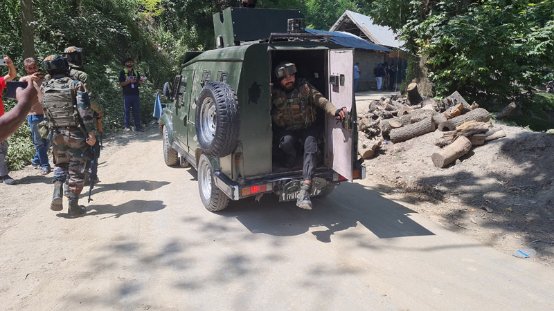 Security personnel at the site of encounter at Frisal, Kulgam on Monday. —Excelsior/Sajad Dar
