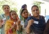 Sikh women displaying voter card while waiting for their turn to cast vote in DGPC elections on Monday.
