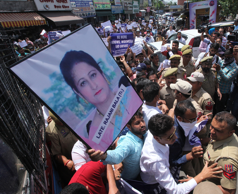 Govt employees carrying photo of teacher Rajni Bala staging protest in Jammu. — Excelsior/Rakesh Govt employees carrying photo of teacher Rajni Bala staging protest in Jammu. — Excelsior/Rakesh