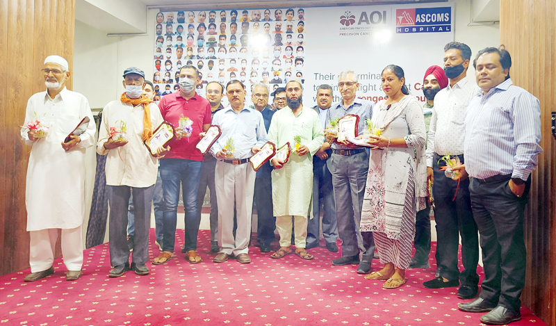 Cancer survivors posing with guests during a function at AOI in ASCOMS Hospital, Jammu. Cancer survivors posing with guests during a function at AOI in ASCOMS Hospital, Jammu.