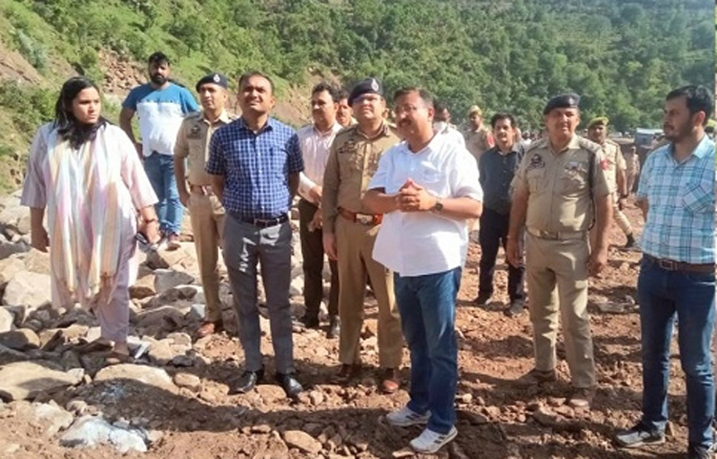 Div Com Ramesh Kumar with other officers inspecting landslide hit areas on Thursday.