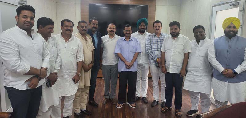 AAP leaders from J&K posing with Delhi CM Arvind Kejriwal at his office in New Delhi.