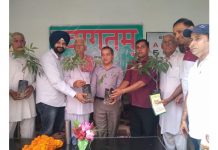 Director Horticulture, Ram Sevak distributing plants among farmers at Sungal in Akhnoor.
