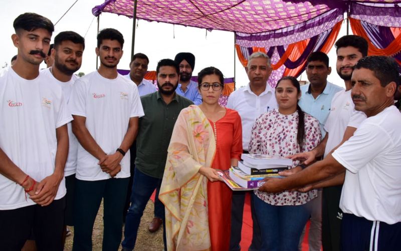 DC Jammu Avni Lavasa providing study material to a girl student for appearing in competitive exams at RS Pura. DC Jammu Avni Lavasa providing study material to a girl student for appearing in competitive exams at RS Pura.