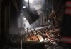 Firefighters trying to douse a fire broke out at Gaffar market, at Karol Bagh, in New Delhi on Sunday. UNI