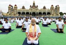 Prime Minister Narendra Modi performing Yoga at Mysore Palace ground on the occasion of 8th International Yoga Day, in Mysuru on Tuesday. (UNI)