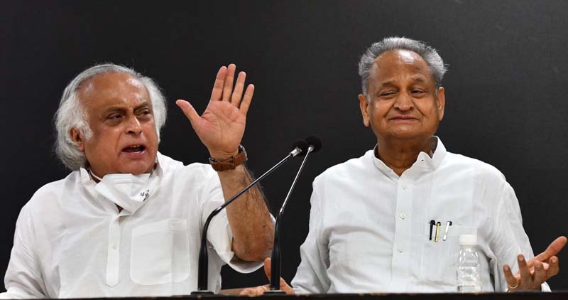Rajasthan Chief Minister Ashok Gehlot with Congress leader Jai Ram Ramesh addressing a press conference at AICC, in New Delhi on Wednesday. (UNI)