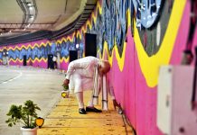 Prime Minister Narendra Modi picking litter while dedicating the six-lane tunnel and five underpasses of the Pragati Maidan Integrated Transit Corridor Project, in New Delhi on Sunday. (UNI)