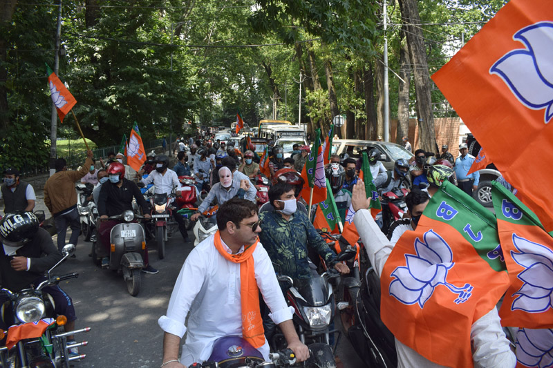 BJP activists and workers taking out a bike rally around Dal Lake in Srinagar on completion of eight years of Narendra Modi led Government in the centre. -Excelsior/Shakeel BJP activists and workers taking out a bike rally around Dal Lake in Srinagar on completion of eight years of Narendra Modi led Government in the centre. -Excelsior/Shakeel