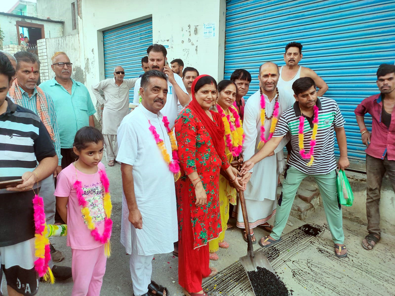 Sarpanch, Seema Gupta, flanked by other Panchayat members kick-starting blacktopping work of Dangal Ground link road at Dinga Amb on Friday. Sarpanch, Seema Gupta, flanked by other Panchayat members kick-starting blacktopping work of Dangal Ground link road at Dinga Amb on Friday.