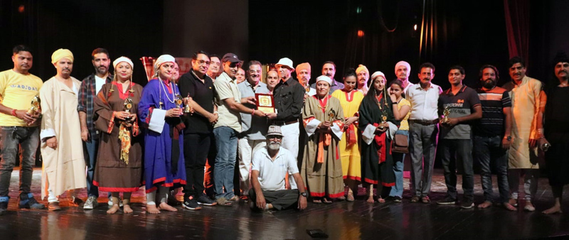 Members of J&K Bhoomi Human Welfare Society along with artists and others after staging play 'Aknandun' in Jammu on Saturday. Members of J&K Bhoomi Human Welfare Society along with artists and others after staging play 'Aknandun' in Jammu on Saturday.