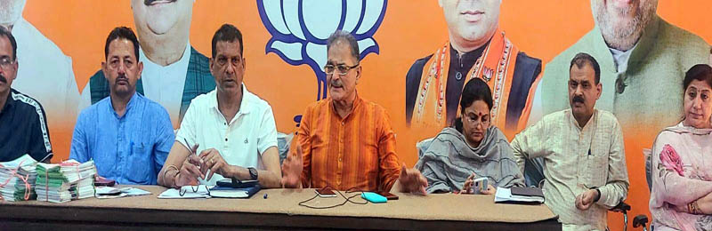 Former Deputy Chief Minister Kavinder Gupta chairing a meeting on Friday.