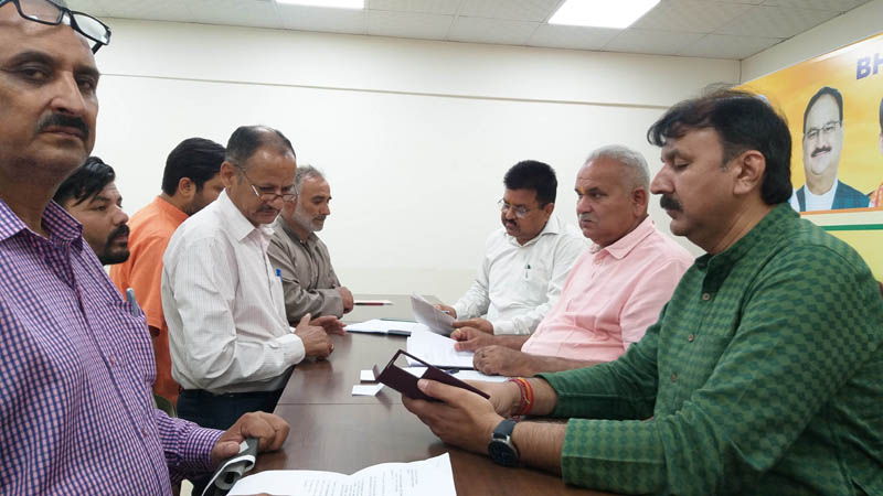 Sham Choudhary, vice president, J&K BJP and other party leaders listening people’s grievances at BJP office Jammu on Friday