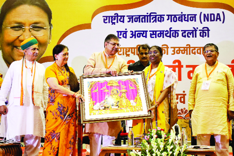 NDA presidential candidate Draupadi Murmu being welcomed by Former Chief Vasundhara Raje,State President Satish Poonia with party leaders ,ahead the upcoming presidential election,in Jaipur on Wednesday. (UNI) NDA presidential candidate Draupadi Murmu being welcomed by Former Chief Vasundhara Raje,State President Satish Poonia with party leaders ,ahead the upcoming presidential election,in Jaipur on Wednesday. (UNI)