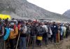 Yatris in queues at Panchtarni ready to leave for holy cave on Sunday. -Excelsior/Sajad Dar