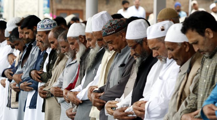 People offer Eid prayers at Hazratbal shrine in Srinagar on Sunday. — Excelsior/Shakeel