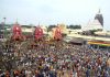 Devotees throng the chariots of Lord Jagannath, Lord Balabhadra and Goddess Subhadra during the annual Rath Yatra of Lord Jagannath, in Puri on Friday. (UNI)