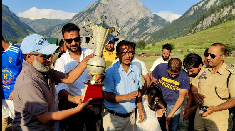 Captain of winning team being awarded with trophy by dignitaries at Gurez on Tuesday. Captain of winning team being awarded with trophy by dignitaries at Gurez on Tuesday.