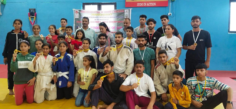 Winners displaying medals while posing with dignitaries at Subash Stadium in Udhampur on Thursday. Winners displaying medals while posing with dignitaries at Subash Stadium in Udhampur on Thursday.