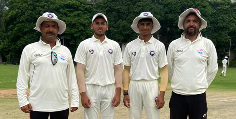 Umpires and Captains posing before toss of coin at Jammu University Ground on Saturday. Umpires and Captains posing before toss of coin at Jammu University Ground on Saturday.