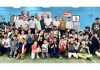 Winners displaying medals while posing for a group photograph at Subash Stadium in Udhampur on Saturday.