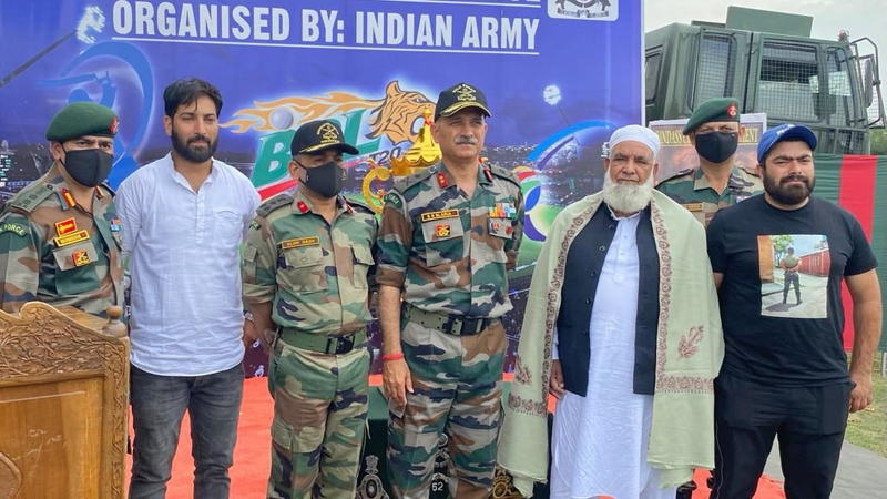 Mohd Maksood Sheikh, father of martyr Constable Mudasir posing for a group photograph along with Army officials at Baramulla on Sunday. Mohd Maksood Sheikh, father of martyr Constable Mudasir posing for a group photograph along with Army officials at Baramulla on Sunday.