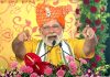 Prime Minister Narendra Modi addressing during the launch of various development initiatives at Sabar Dairy, in Sabarkantha on Thursday. (UNI)