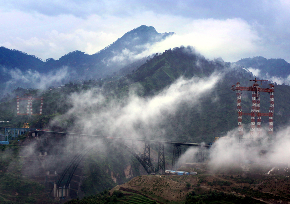 Panoramic view of world’s highest Chenab rail bridge under the clouds at Kauri in Reasi district of Jammu. -Excelsior/Rakesh