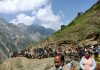 Amarnathji pilgrims trekking a hill on way to holy cave on Saturday.