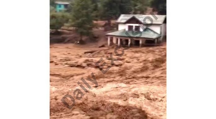Flash flood in Kahra Nallah after cloudburst in upper reaches of Doda on Wednesday. —Excelsior/Tilak Raj