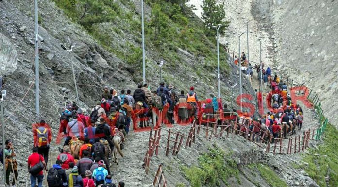 Pilgrims on way to holy cave via Baltal track on Thursday. -Excelsior/Shakeel