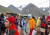 Yatris at Panchtarni bracing up to leave for holy cave as Amarnath pilgrimage resumed on Monday. -Excelsior/Sajjad Dar